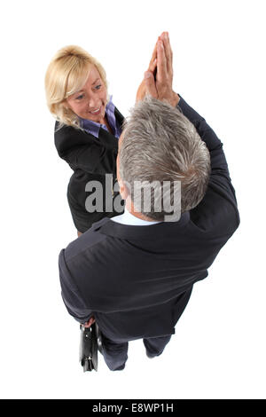 Exekutive paar fiving Stockfoto