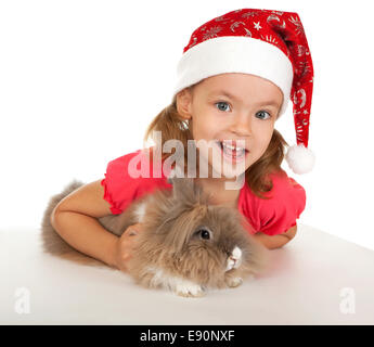 Kind im Neujahr Hut mit einem Kaninchen. Stockfoto