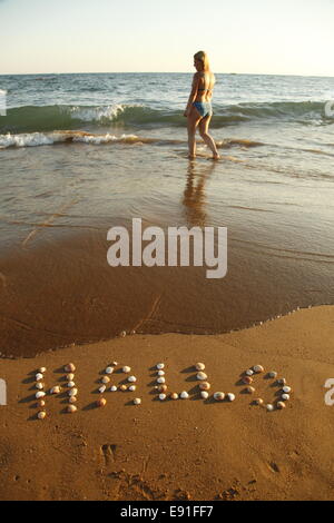 Frau am Strand Stockfoto