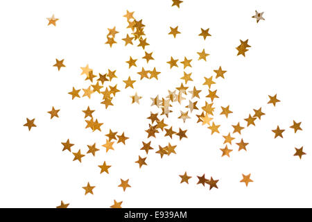 Urlaub-Hintergrund mit kleinen goldenen Sternen isoliert auf weiss Stockfoto
