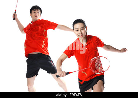 Athleten, die Badminton spielen Stockfoto