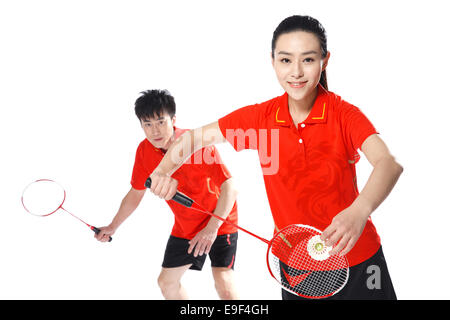 Athleten, die Badminton spielen Stockfoto