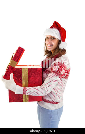 Öffnen ein magisches Weihnachtsgeschenk Mädchen Stockfoto