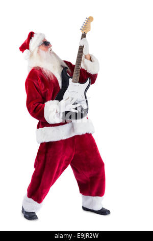 Santa Claus spielt Gitarre mit Sonnenbrille Stockfoto