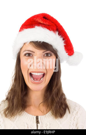 Junge Frau in Santa Hut schreien Stockfoto