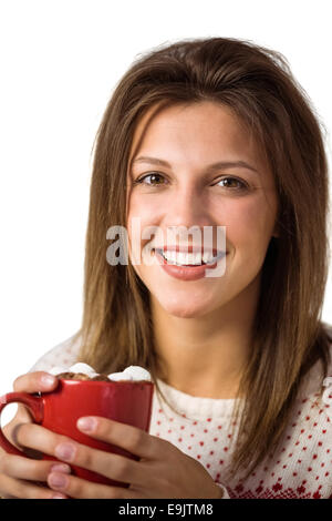 Hübsche Frau mit einer Tasse Kaffee auf dem Sofa sitzen Stockfoto