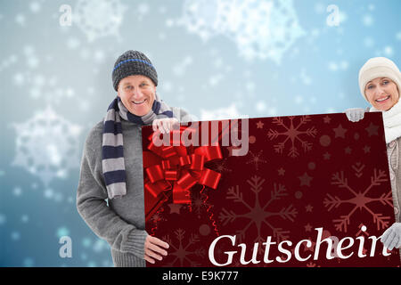 Zusammengesetztes Bild Winter paar zeigt Poster Stockfoto