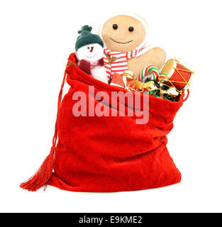 Santas Geschenk Tasche voller Spielzeug und Geschenke in weiß Stockfoto