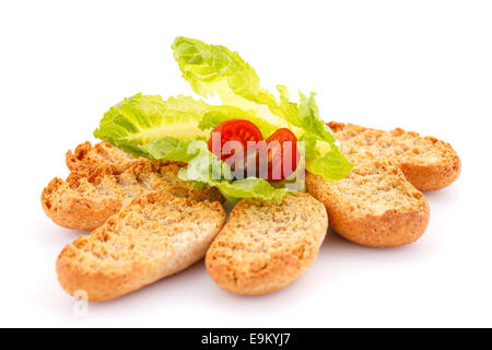 Zwieback und Gemüse isoliert auf weißem Hintergrund. Stockfoto