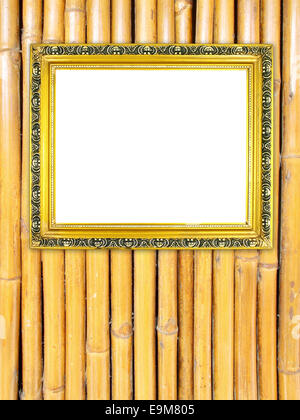 leere Goldrahmen auf Bambus Wand Hintergrund Stockfoto