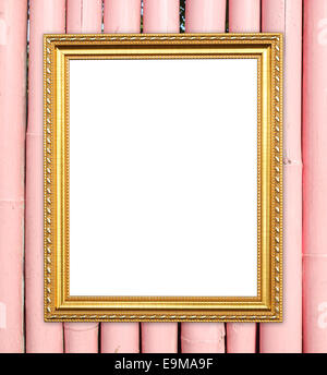 leere Goldrahmen auf Bambus Wand Hintergrund Stockfoto