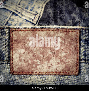 Grunge, zerkratzte Leder-Jeans-Label Jeans genäht. Stockfoto