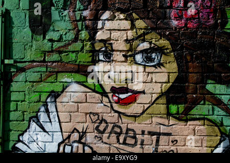 Graffiti Berlin Mauer Ziegel Womans Gesicht Umlaufbahn Stockfoto