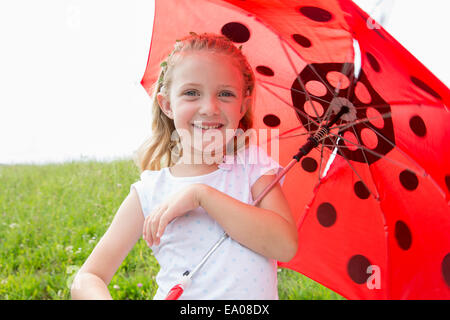 Mädchen mit Regenschirm Stockfoto