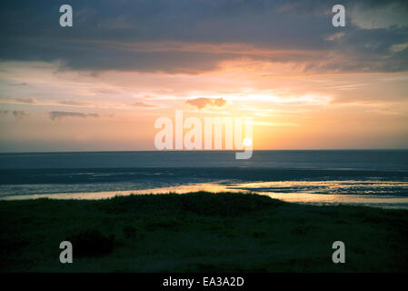 Sonnenuntergang über dem Wattenmeer Stockfoto