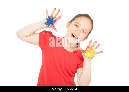 kleines Mädchen mit Händen in der Farbe Stockfoto