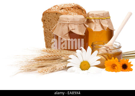 Honig und Brot auf weiß Stockfoto