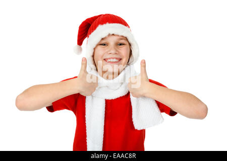 fröhlicher Junge in Santa Claus Hut auftauchend Daumen, auf weiß Stockfoto