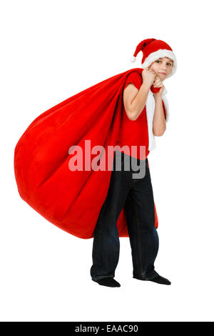 Junge im Weihnachtsmann-Mütze mit Rot Weihnachten Geschenk Tasche auf weiß Stockfoto