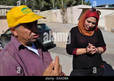 Angeblich ist die einzige Institution in Palästina, dessen Schwerpunkt auf der Arbeit mit geistig behinderten Kindern, der Center Star läuft Berg in der Nähe von Ramallah von der Kirche der Mährischen Brüder, die in den böhmischen Ländern stammt. Abgebildete Lehrer für landwirtschaftliche Arbeiten Abu Anas und Koordinator des Handwerks-Lehre und Kunst-Therapie Heba al Umari in der Nähe von Ramallah, Palästina, 6. November 2014. (Foto/Filip Nerad CTK) Stockfoto