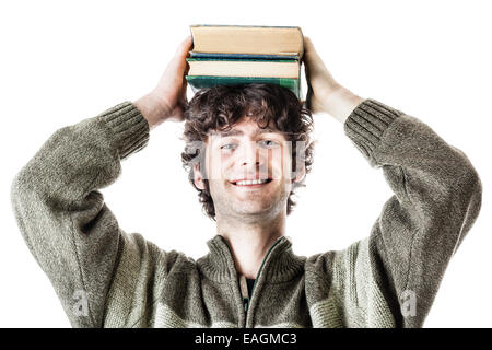 eine hübsche Studentin mit einige Bücher über einen weißen Hintergrund isoliert Stockfoto