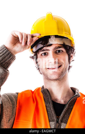 gut aussehend Architekt oder Ingenieur oder Vorarbeiter trägt einen Helm und Warnweste und tragen einige Baupläne. Isolat Stockfoto