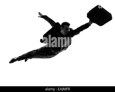 ein kaukasischer super Geschäftsmann fliegen in Silhouette auf weißem Hintergrund Stockfoto