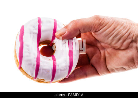 eine Hand hält einen leckeren Donut isoliert auf einem weißen Hintergrund Stockfoto