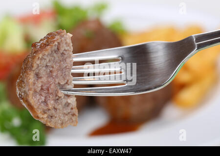 Frikadellen Essen mit einer Gabel zum Mittagessen Stockfoto