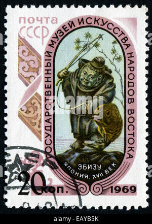 UdSSR - ca. 1969: Eine Briefmarke gedruckt in der USSR zeigt Skulptur von Ebisu, der japanische Gott der Fischer, Glück und workingmen Stockfoto