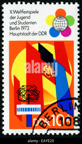 Deutschland - CIRCA 1973: Briefmarke gedruckt durch Deutschland, zeigt das Emblem des zehnten Weltfestspiele der Jugend und Studenten, ca. 1973. Stockfoto