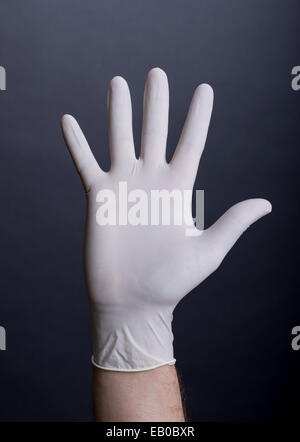 Männlichen Palme in Latex-Handschuh Stockfoto