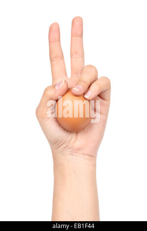 braune Ei in der Hand auf weißem Hintergrund Stockfoto
