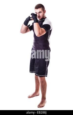 eine junge Kickboxer oder Boxer vor einem weißen Hintergrund isoliert Stockfoto
