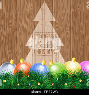 Thema Weihnachten mit Holzbrettern, Kugeln, Tannenzweigen, Retro Label und Baum, Hintergrund. Stockfoto