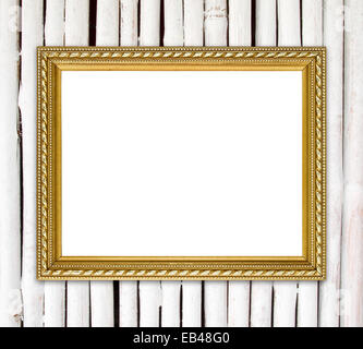leere Goldrahmen auf Bambus Wand Hintergrund Stockfoto