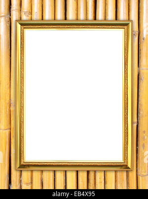 leere Goldrahmen auf Bambus Wand Hintergrund Stockfoto