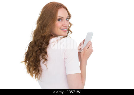 Hübsche Rothaarige senden SMS Stockfoto