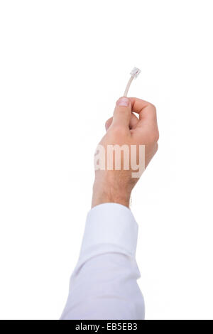 Nahaufnahme von Unternehmenshilfe Hand mit Kabel Stockfoto