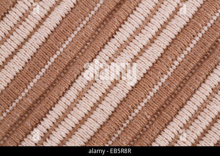 Braune und weiße gestrickte Tuch als Hintergrund. Stockfoto