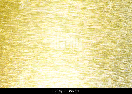 Goldene Metall Messing zerkratzt Hintergrund Textur closeup Stockfoto