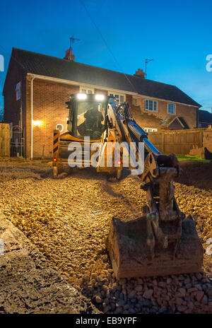 JCB hardcore auf einer Einfahrt zu verbreiten. Stockfoto