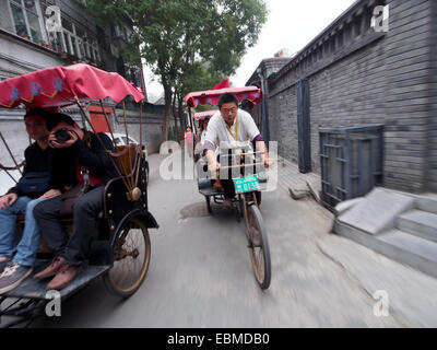 Rikscha-Fahrt durch die Straßen von Peking, China Stockfoto