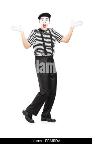 In voller Länge Portrait von einem MIME-Künstler gestikulieren Freude mit seinen Händen isoliert auf weißem Hintergrund Stockfoto