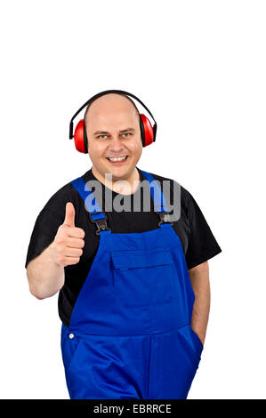 Handwerker mit Lärmschutz pochen Stockfoto
