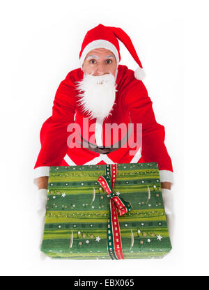 Santa Claus mit Weihnachtsgeschenk Stockfoto