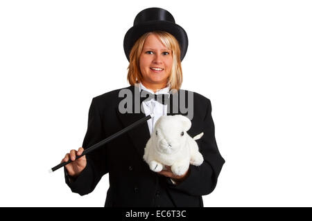 Junge Frau mit Stovepipe Hut hält ein Zauberstab und ein weißen Kaninchen Stockfoto