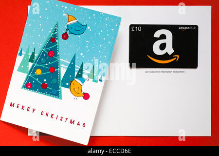 Amazon Frohe Weihnachten giftcard mit Vögeln schmücken Weihnachtsbaum Geschenkkarte auf rotem Hintergrund einstellen Stockfoto