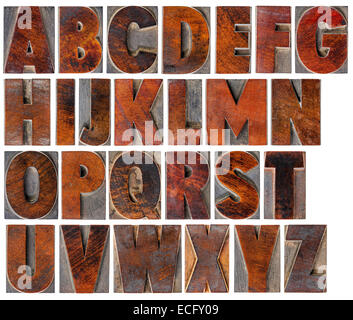 eine komplette englische Großbuchstaben-Alphabet - eine Collage aus 26 isolierte Antik Holz Buchdruck Druckstöcke mit Tinte patina Stockfoto
