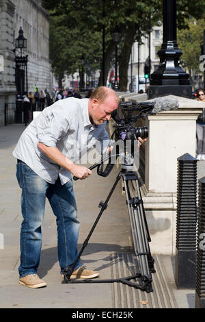 Fotograf nimmt Bilder auf den Straßen von London Stockfoto